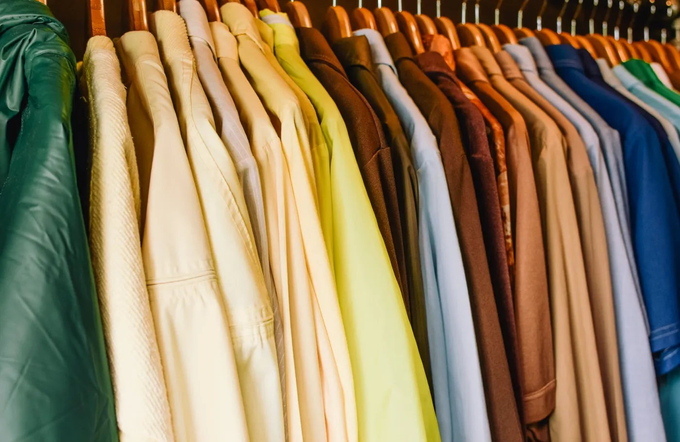 A colorful, well-organized wardrobe of clothing